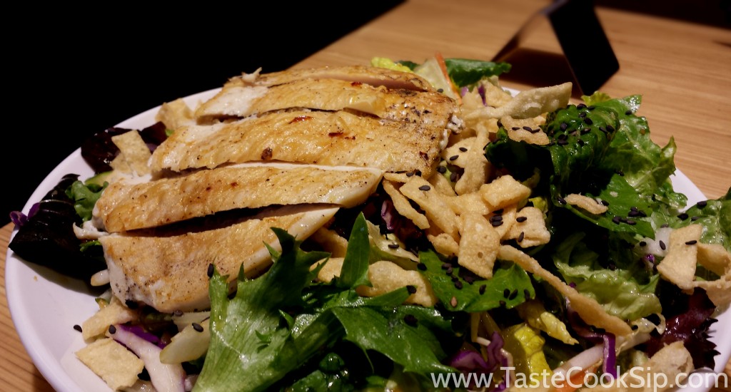 Chinese Chicken Chop Salad. Grilled Chicken, sesame-soy tossed mixed greens, Asian sprouts, cabbage, red bell pepper, cucumbers, carrots, crispy wontons and black sesame