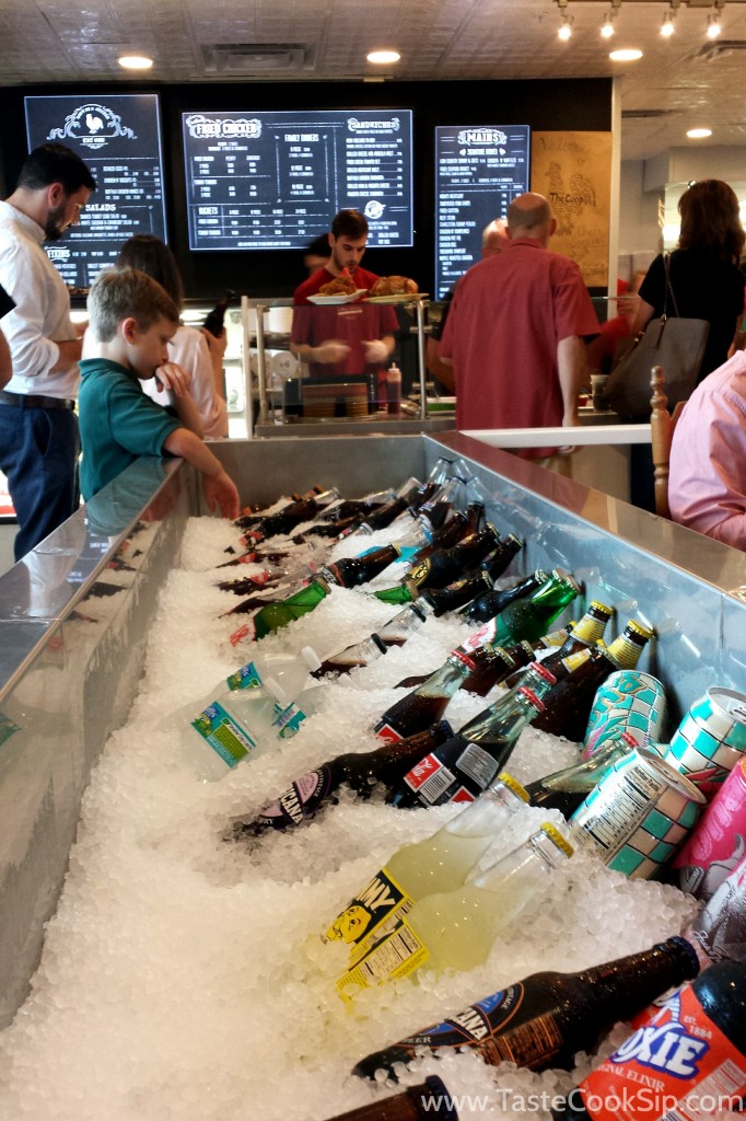 The large beverage cooler is stocked with with iced down retro & beloved southern bottled sodas. (Cheerwine was stocked.)