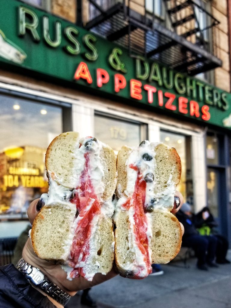 Bagel cut in half in front of Russ & Daughters, NYC